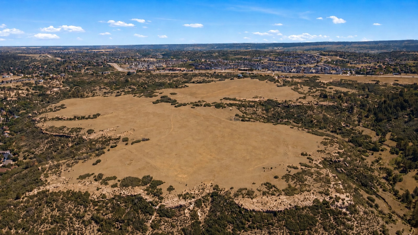 Aerial view of the open meadow and foothills